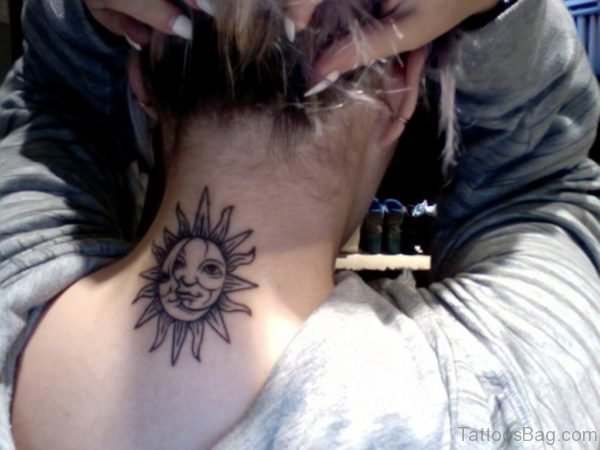 Big Sun Face Tattoo On Neck Back