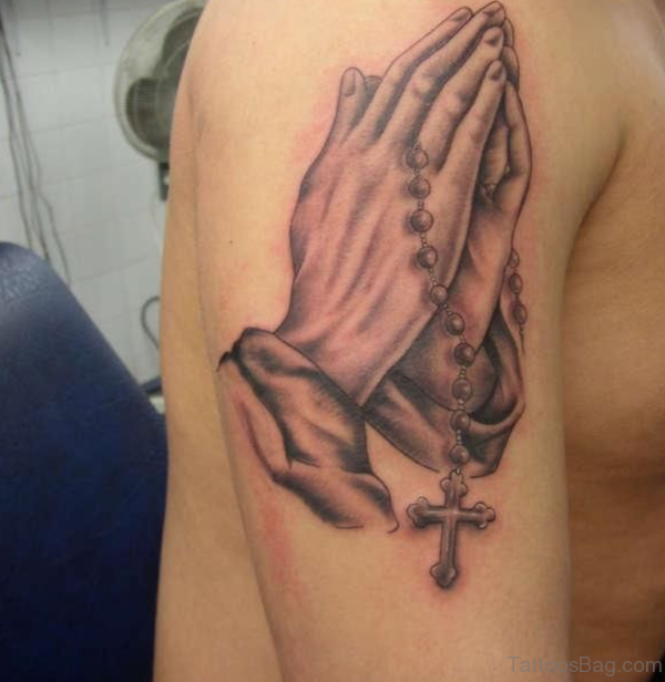 Black And Grey 3D Rosary Cross In Praying Hands Tattoo On Shoulder