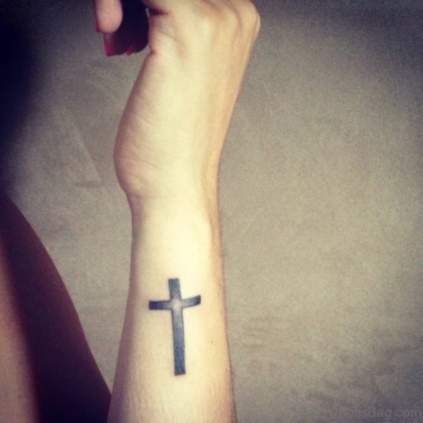 Black Cross Tattoo On Side Wrist