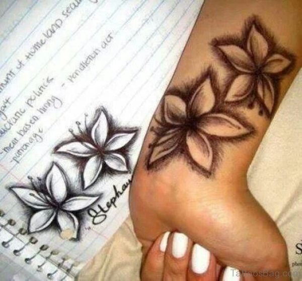 Black Hibiscus Wrist Tattoo
