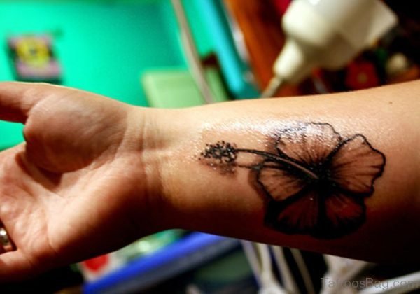 Black Hibiscus Wrist Tattoo