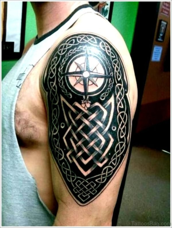 Black Ink Amazing Celtic Knot And Compass Tattoo On Men Shoulder