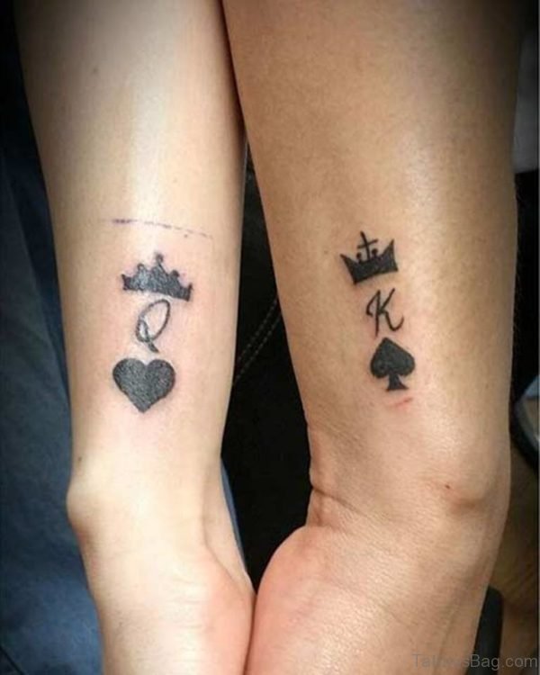 Black K And Q Tattoo On Wrist