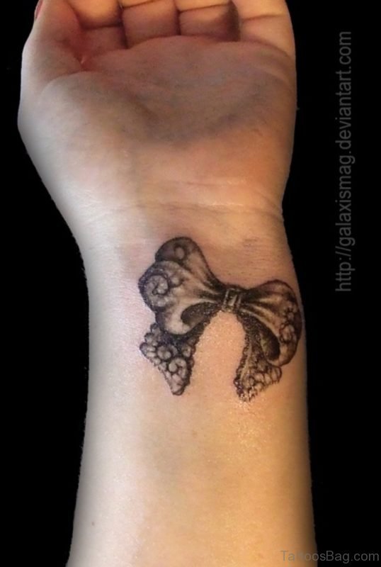 Black Ribbon Tattoo On Wrist