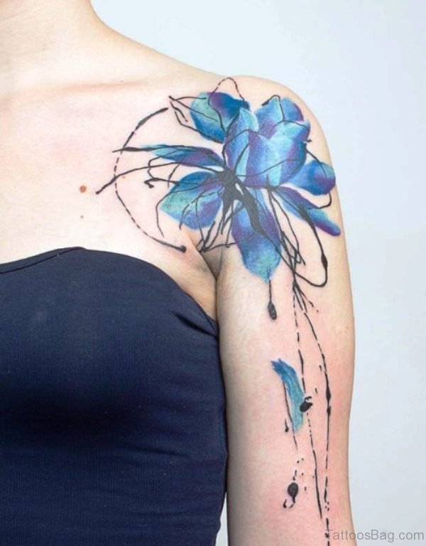 Blue Colored Tattoo On Front Shoulder