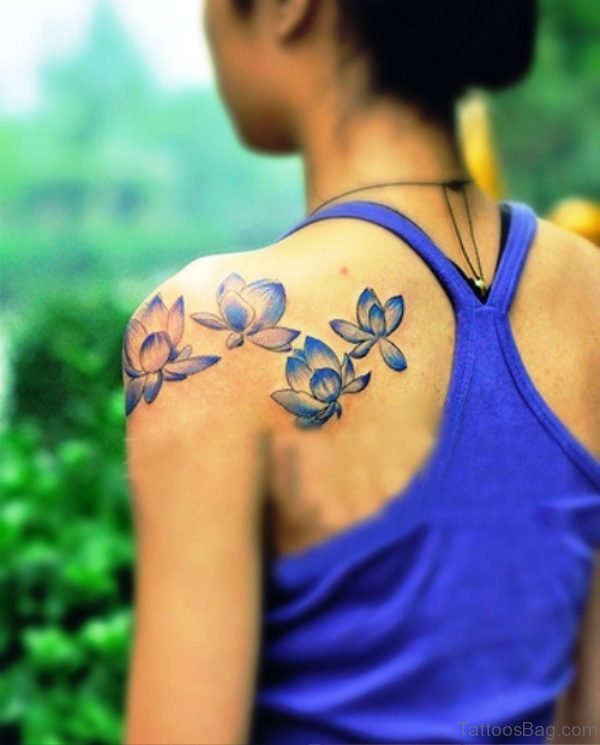 Blue Flower Tattoo On Back Shoulder