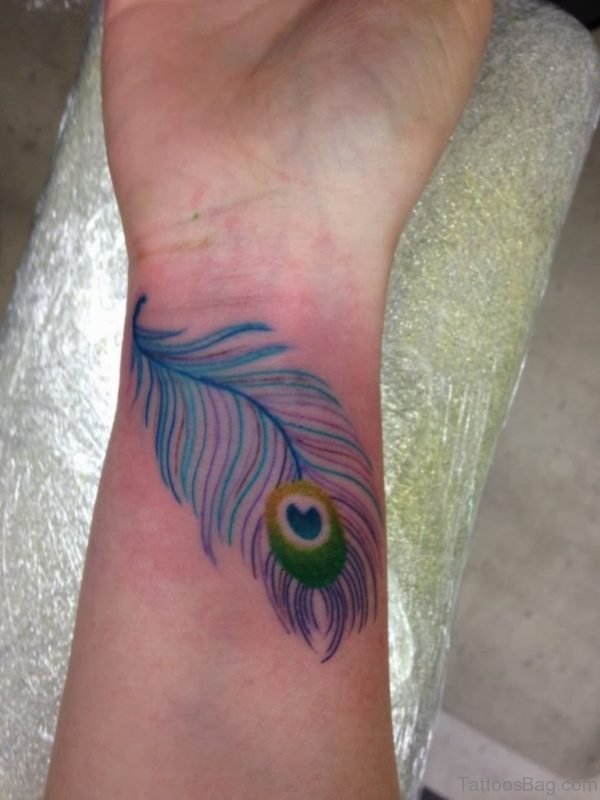 Blue Peacock Feather Wrist Tattoo