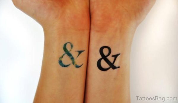 Colored And Black Ampersand Wrist Tattoo