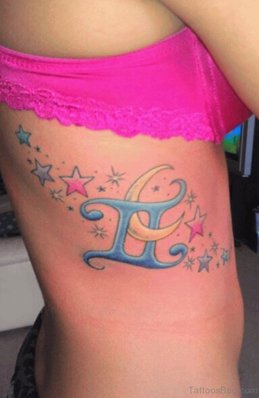 Colored Stars And Gemini Sign With Moon Tattoo