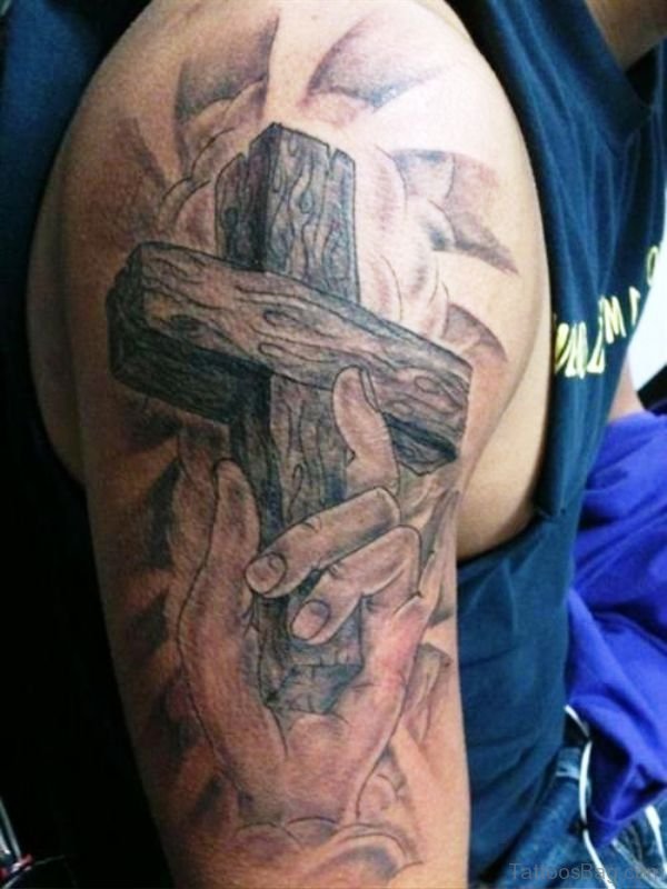 Cross In Hand Tattoo Design