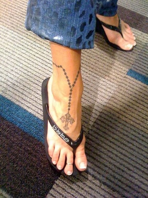 Cross Tattoo On Girl Ankle