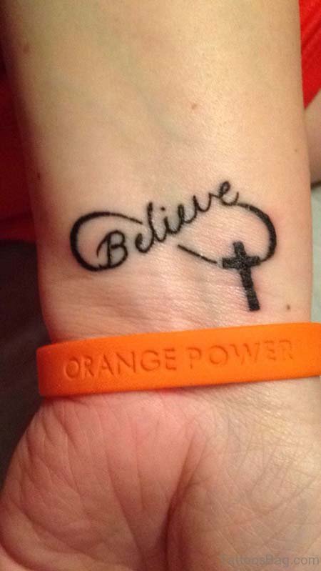 Cross Wrist Tattoo With Believe Design