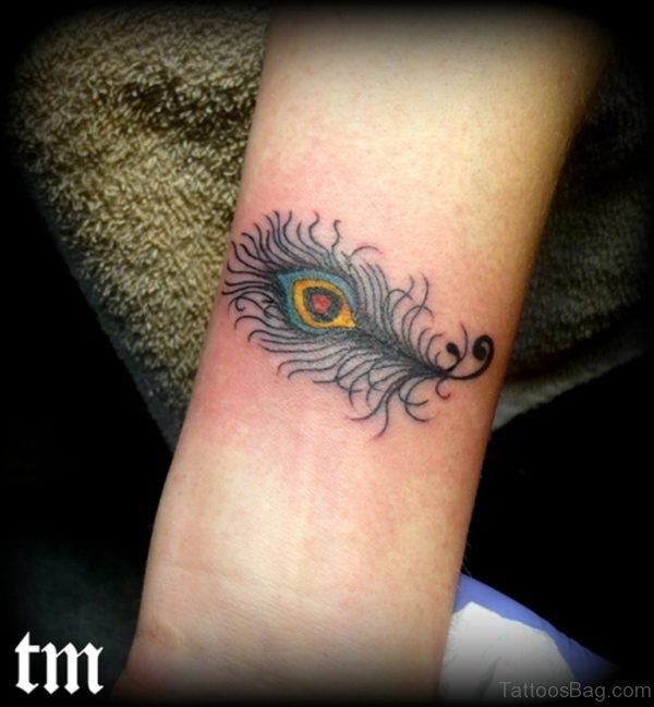 Cute Small Peacock Feather Wrist Tattoo