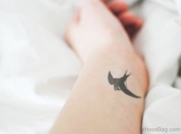Cute Wrist Swallow Tattoo