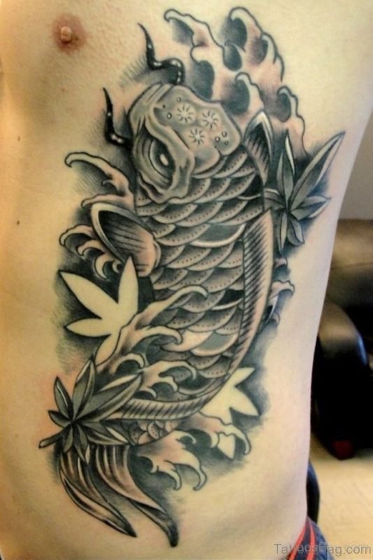Dark Black Fish Tattoo On Rib