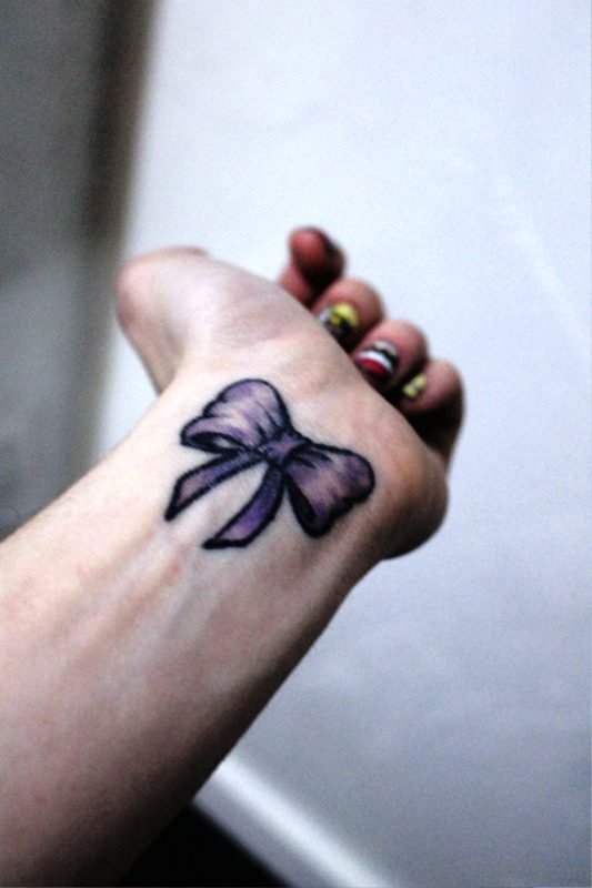Dazzling Bow Tattoo On Wrist