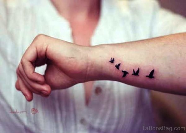 Elegant Flying Birds Tattoo On Wrist