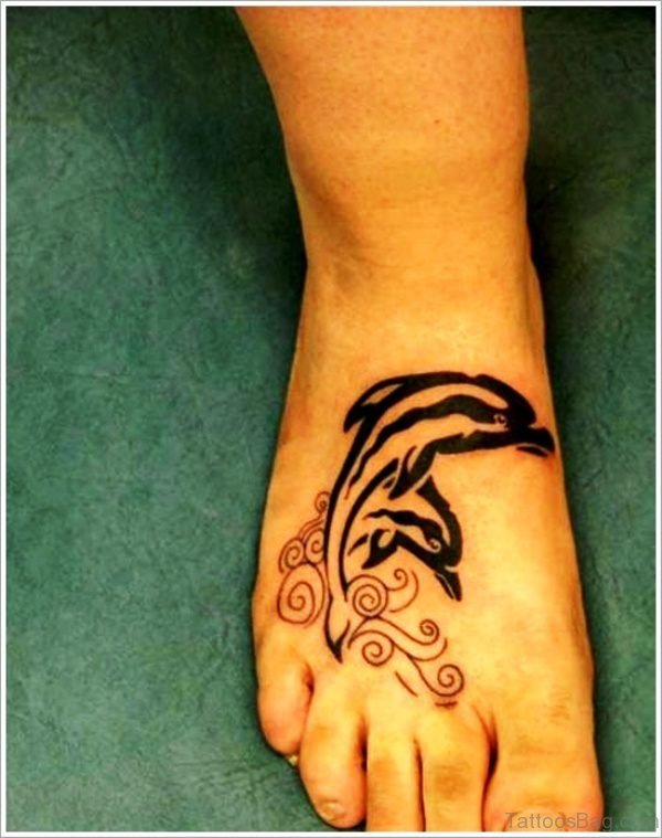 Excellent Dolphins Tattoo On Foot