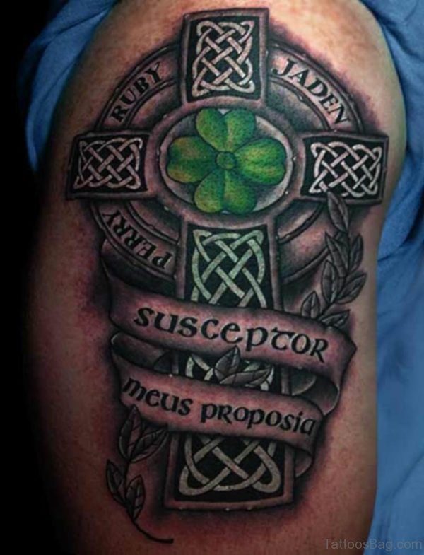 Green Clover Leave In Celtic Cross With Banner Tattoo On Shoulder
