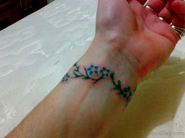 Green Flowers Tattoo On Wrist
