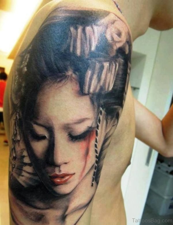 Grey Geisha Face Tattoo On Man Shoulder