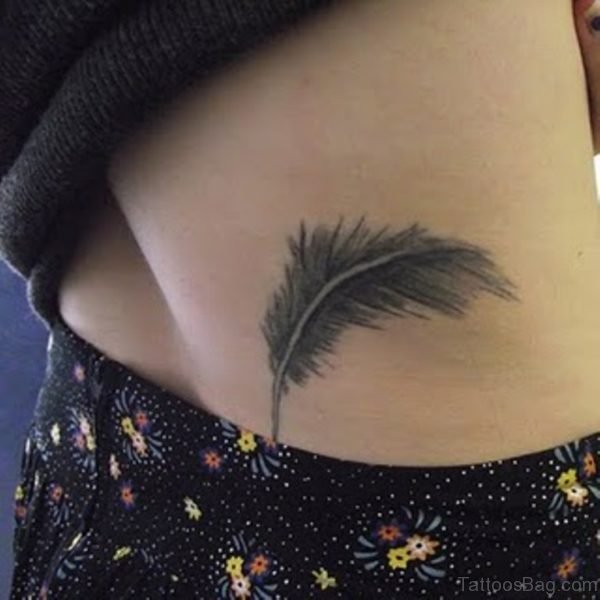 Grey Ink Feather Tattoo