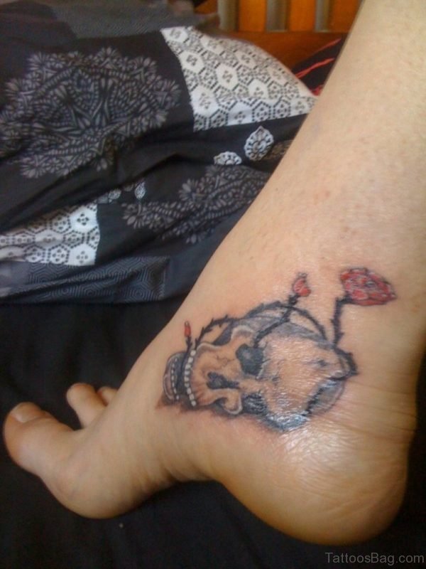 Grey Ink Skull Tattoo On Ankle
