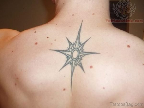 Grey Star Tattoo On Back