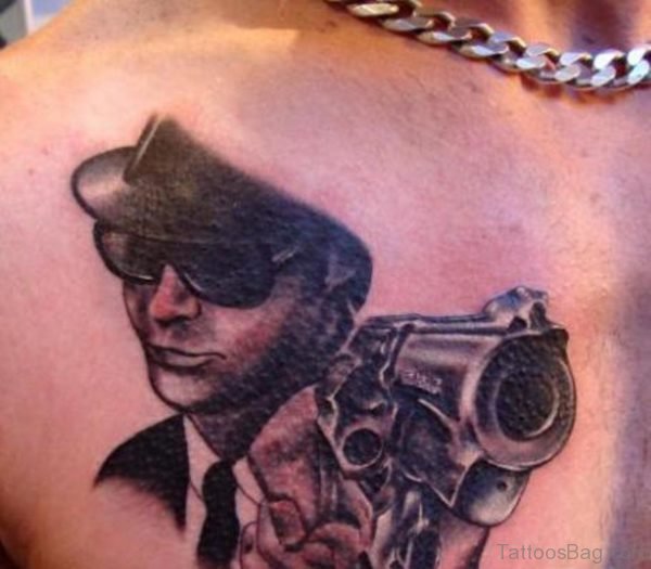Guy With Gun Dark Ink Portrait Tattoo On Chest