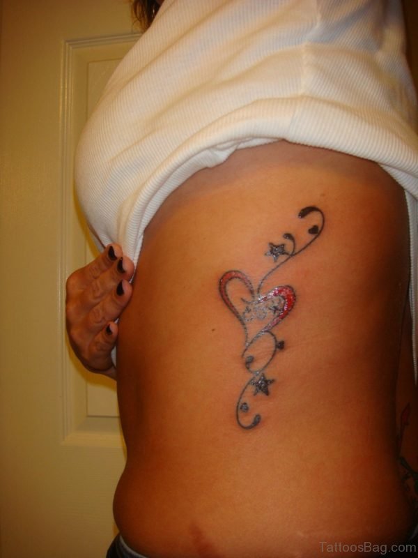 Heart And Star Tattoos On Left Side Rib