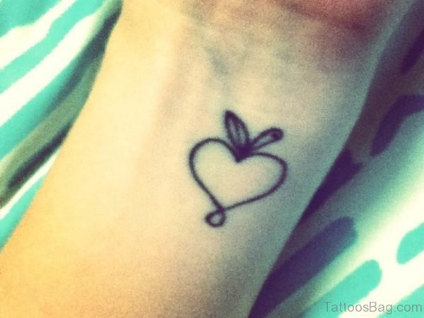 Half Black Apple Tattoo On Wrist