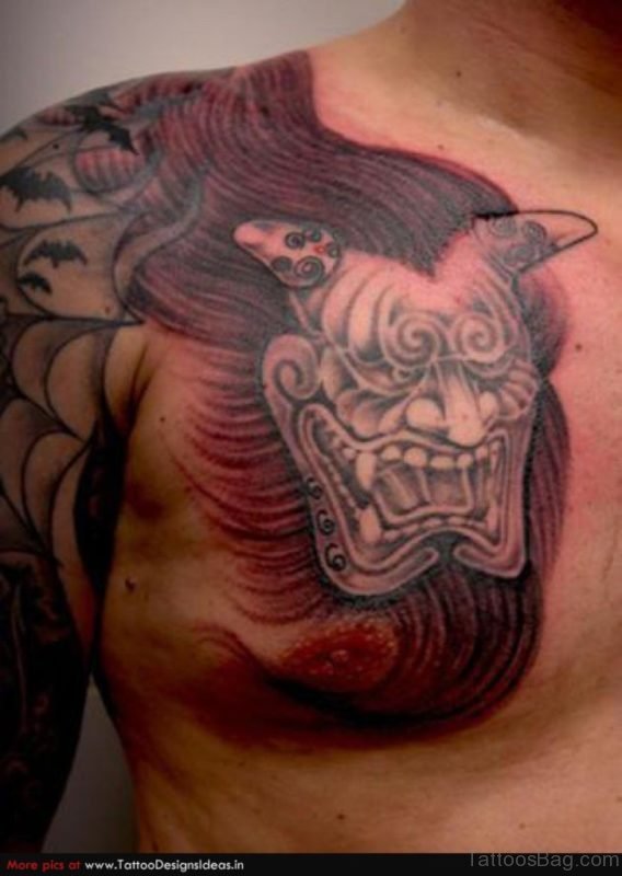 Horrible Devil Mask Tattoo Design On Chest