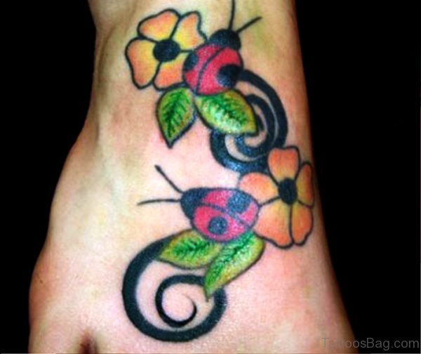 Ladybugs With Colorful Flowers Tattoo