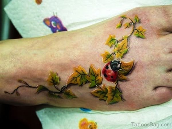 Leaves With Ladybug Tattoo On Foot