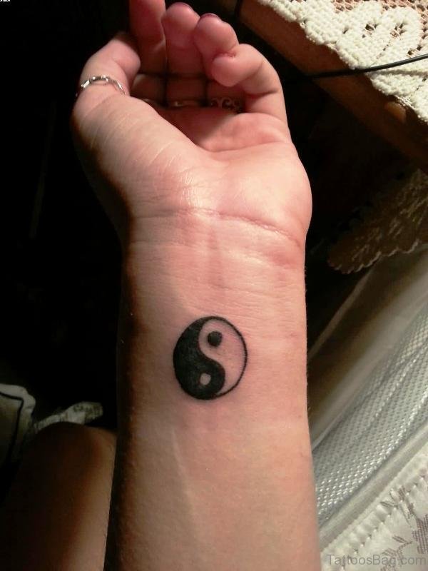 Little Yin Yang Tattoo On Wrist