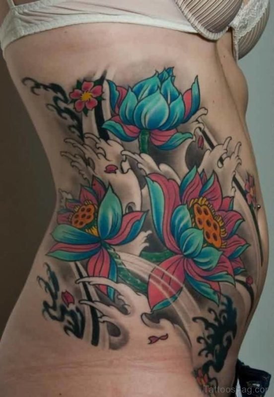 Lovely Japanese Grey Waves And Lotus Tattoos On Rib Side