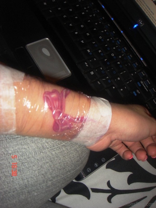 New Pink Bow Tattoo On Wrist