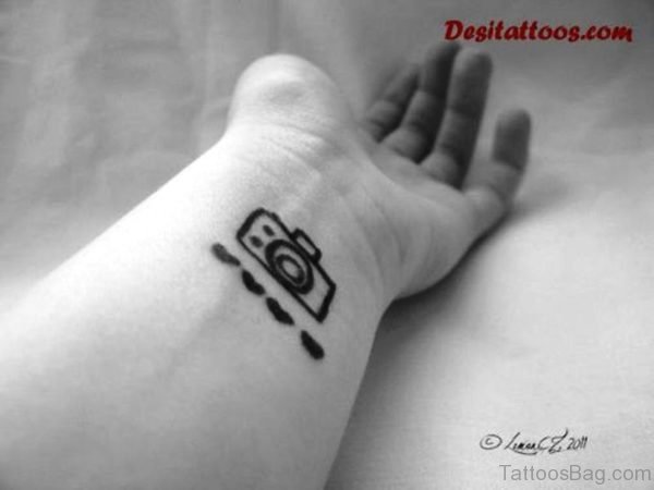Nice Black And White Camera Wrist Tattoo