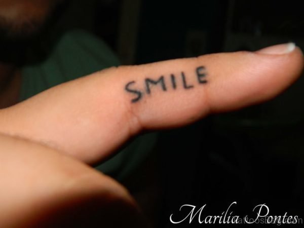 Nice Smile Tattoo Design On Finger