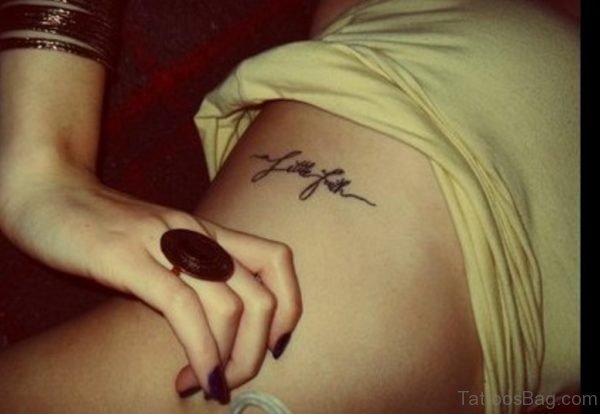 One Word Rib Tattoo