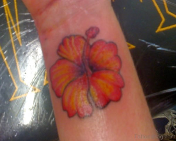 Orange Hibiscus Wrist Tattoo