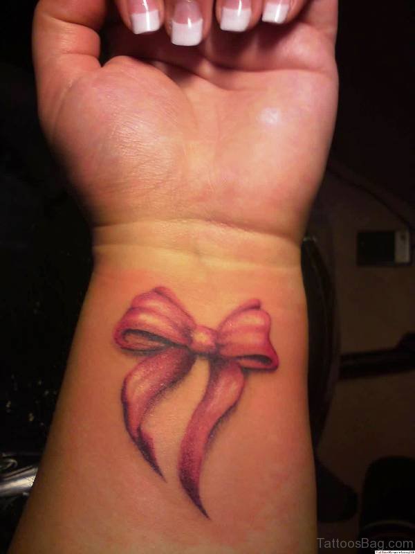 Pink Ribbon Bow Tattoo On Wrist
