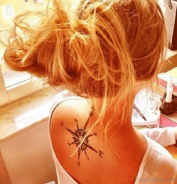 Pretty Girl with Compass Tattoo On Her Back