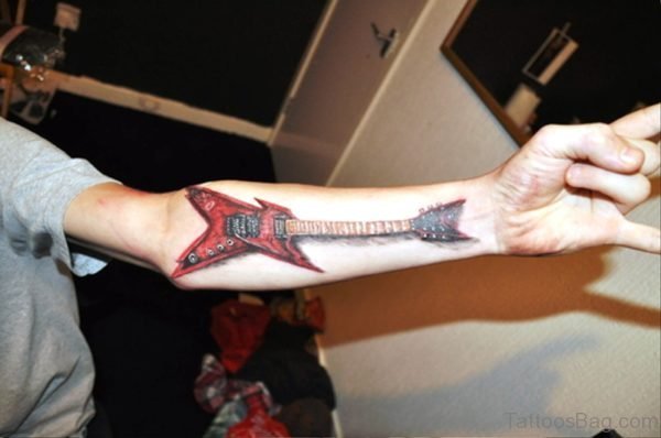 Red Coloured Guitar Tattoo On Forearm