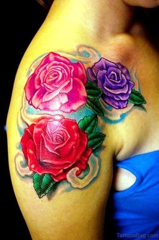Red, Pink And Magenta Flower Tattoo On Shoulder