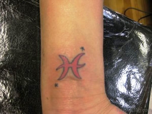 Red Pisces Wrist Tattoo