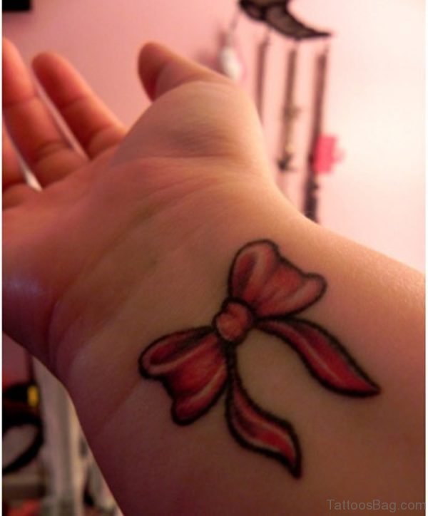Red Ribbon Tattoo On Wrist