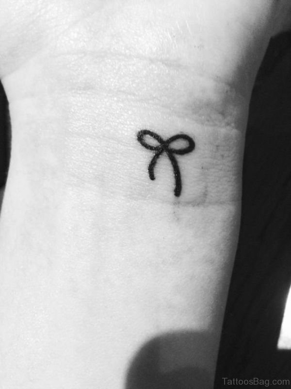 Simple Black Bow Tattoo On Wrist