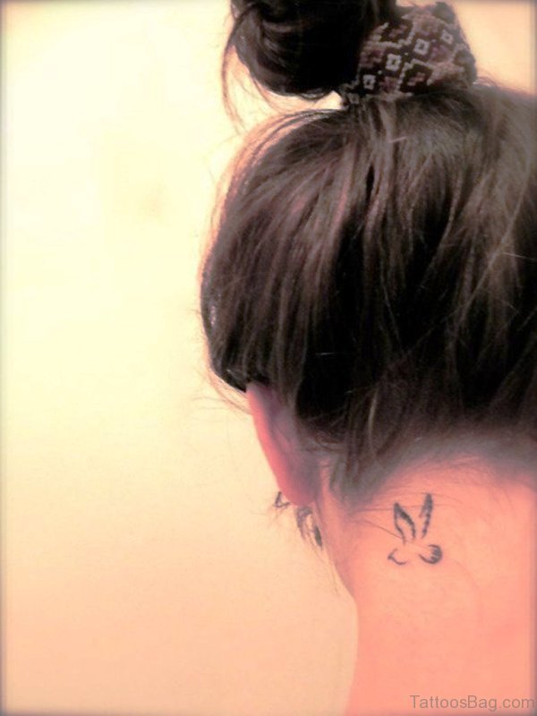 Small Bird Tattoo On Neck