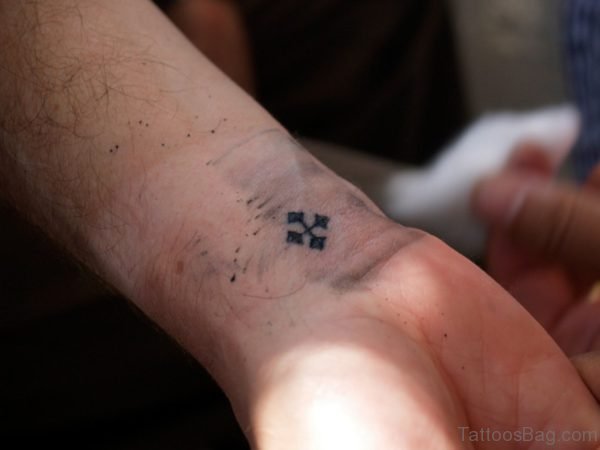 Small Black Cross Tattoo
